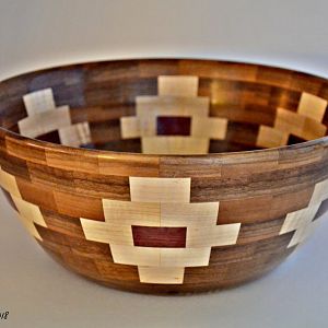 12" diameter x 6" height, 144 segments, Walnut, Maple, Purpleheart.  Fun to make, and getting faster at making them.  Great gifts.