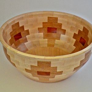 12" diameter x 6" height, 144 segments, Maple, Sapele and Padauk.  Fun to make, and getting faster at making them.  Great gifts.
