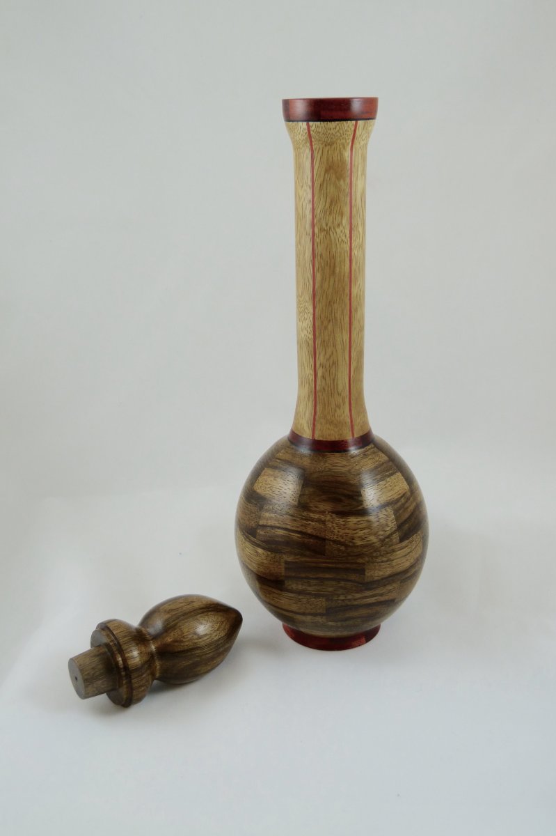 Black and white limba vase, with stopper out.
