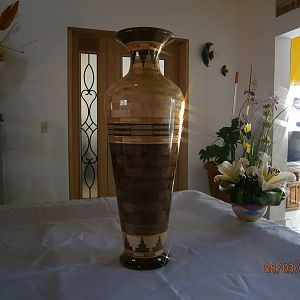 Vase with designs shaped towers at the top and bottom